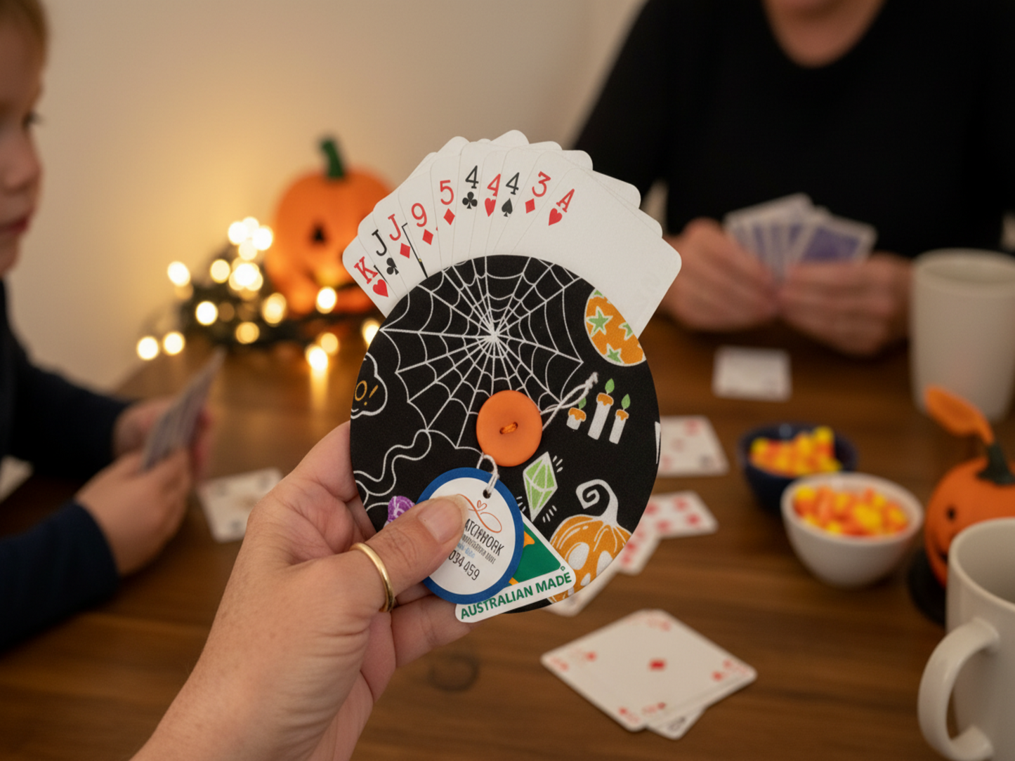 Halloween helping hand card holder in use