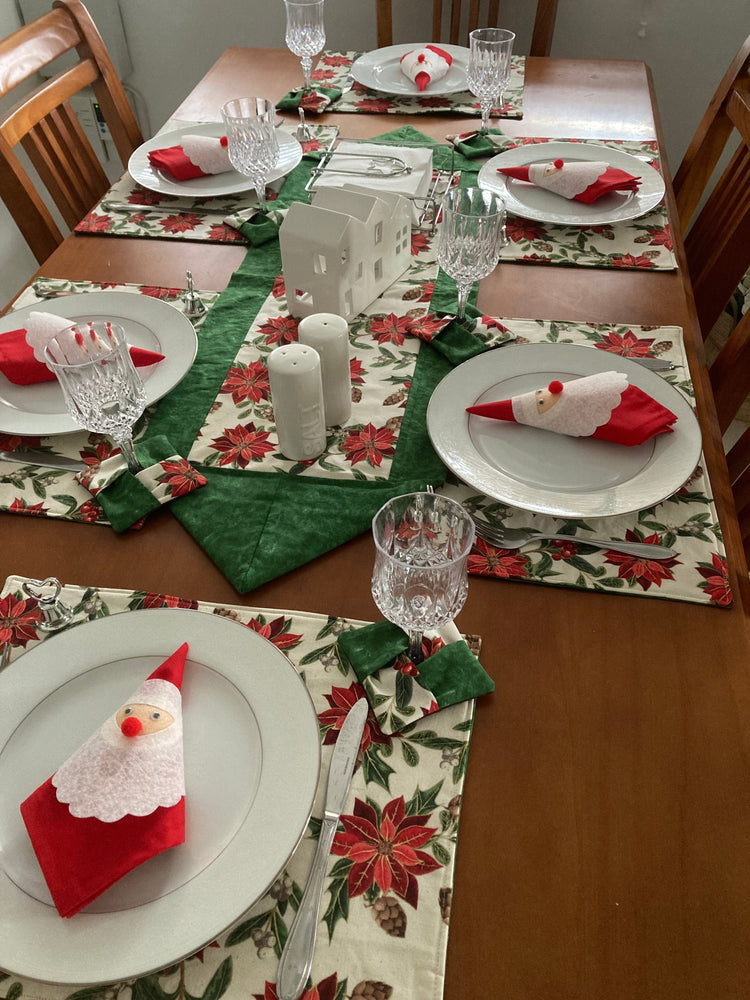Handmade Christmas table runner with festive baubles and poinsettia designs on dining table - Australian made quilted cotton