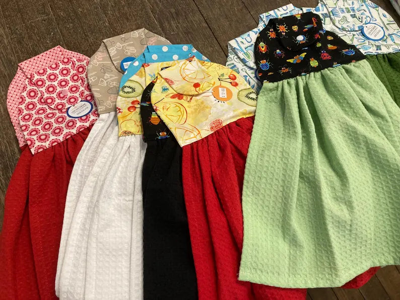 Handmade hanging tea towels with secure fasteners in assorted colourful prints