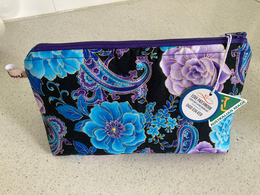 Australian Made Floral patterned pouch with a visible Love Patchwork brand tag and on a light surface