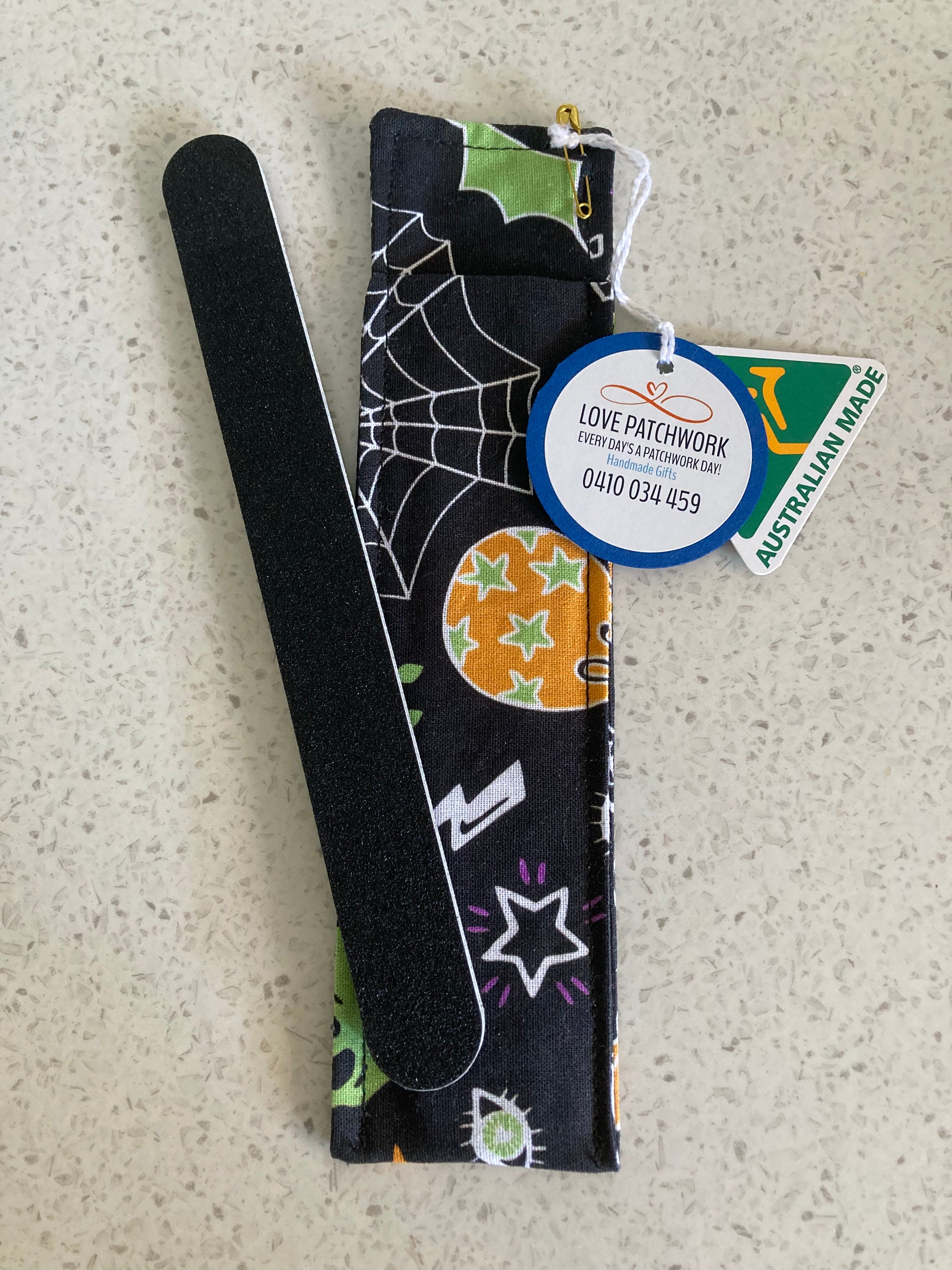 Nail file holder in Halloween-themed design cotton fabric on a textured surface with Love Patchwork & Australian Made tags