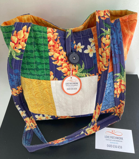 Colourful Tropical floral frangipani patchwork tote bag with cross-body handle  and button closure with Love Patchwork brand label